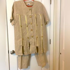 Linen pants suit in size L. Suit comes with pants, jacket and interior vest.